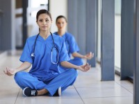 young healthcare workers meditation during break